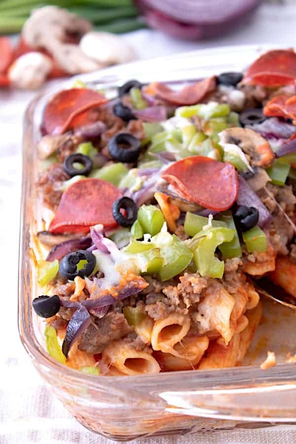 Close up of pizza casserole in a clear casserole dish