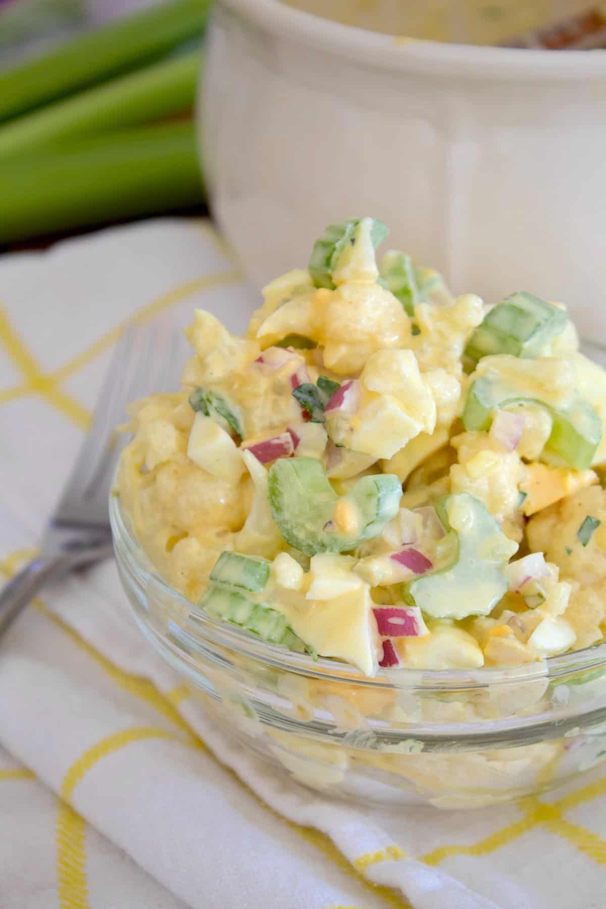 cauliflower potato salad in a clear dish