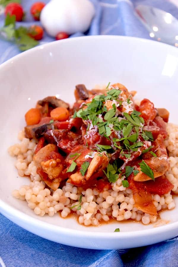 moroccan chicken stew in a white bowl