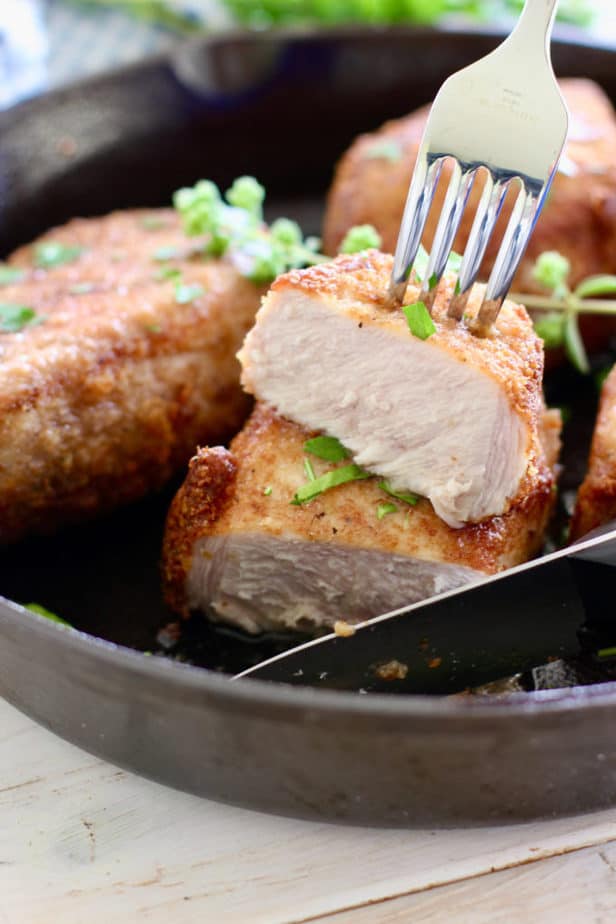 parmesan crusted pork chops sliced and juicy