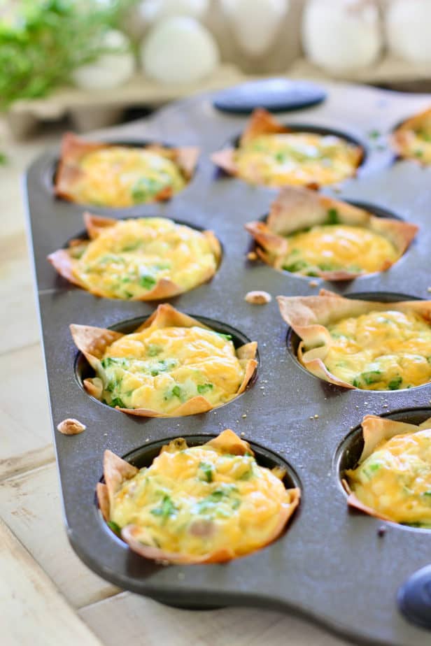 mini quiche in a muffin tin out of the oven