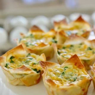 mini quiche in a wonton wrapper on a white platter