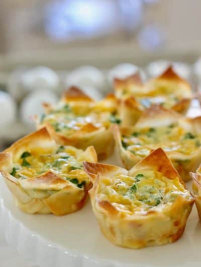 mini quiche in a wonton wrapper on a white platter