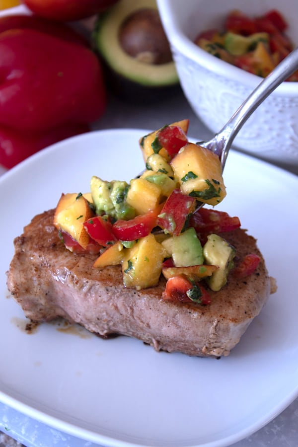 peach salsa on seared pork chop