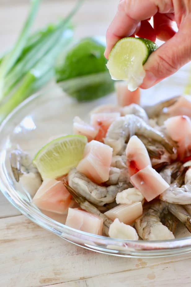 squeeze lime over uncooked fish and shrimp before cooking