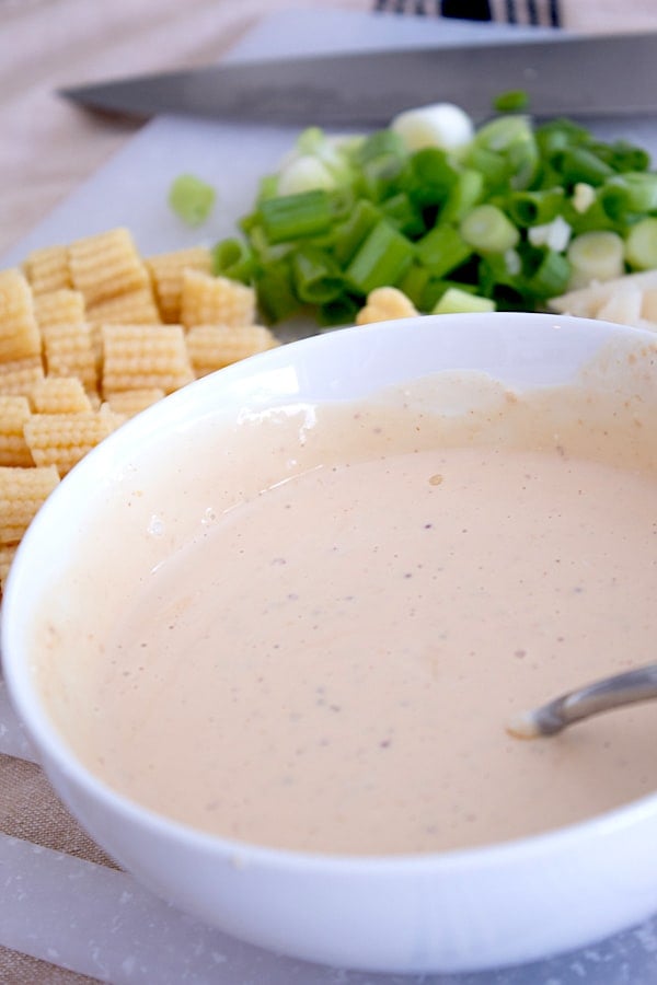 a bowl of mixed asian rice dressing