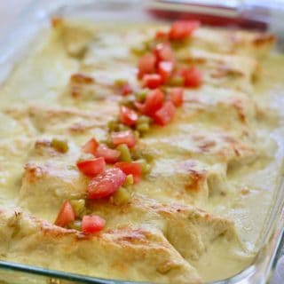 Whit Chicken Enchiladas in a clear 9 x 13 casserole