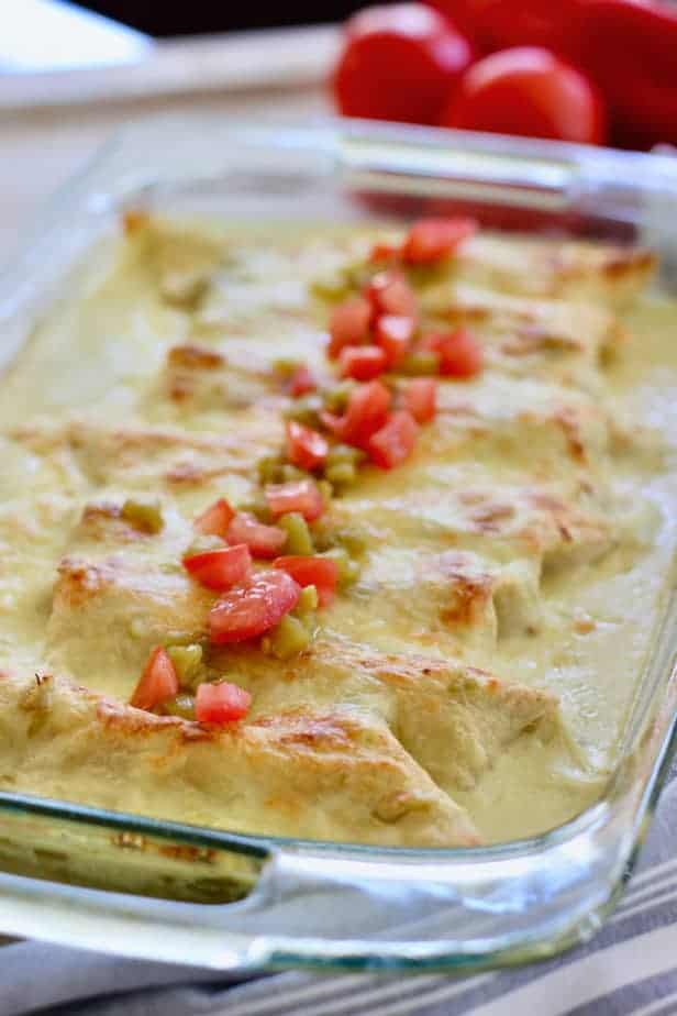 Whit Chicken Enchiladas in a clear 9 x 13 casserole