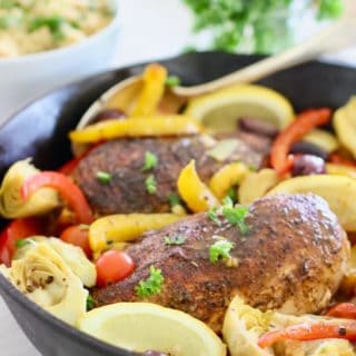 chicken and Mediterranean spices and veggies in a skillet