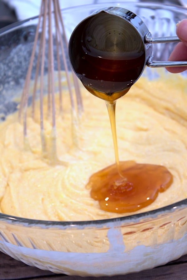 adding honey to cornbread muffin batter