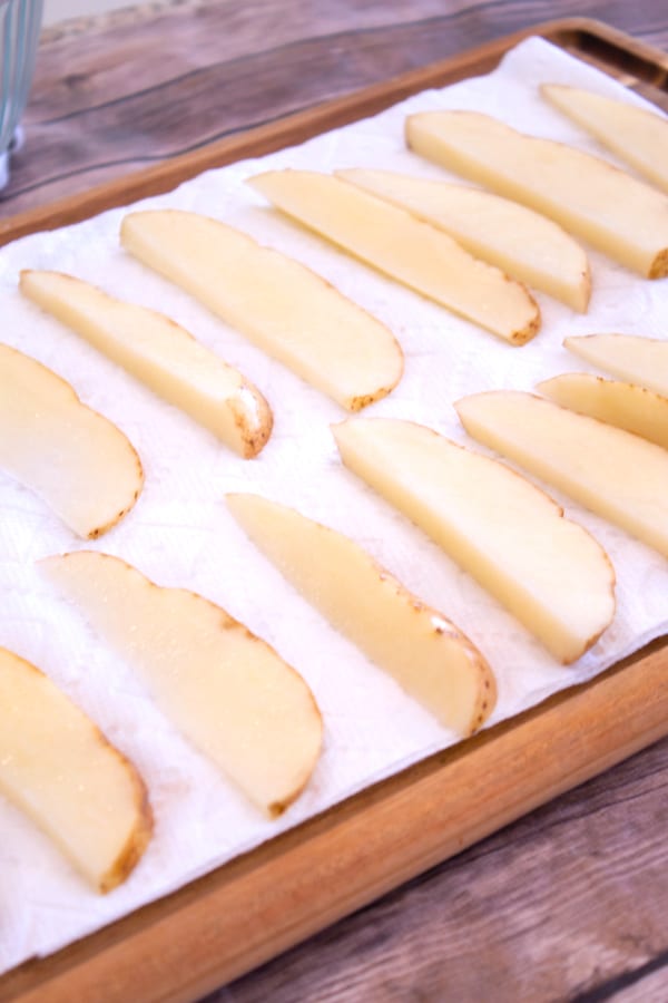 potato wedges laying out on paper towel