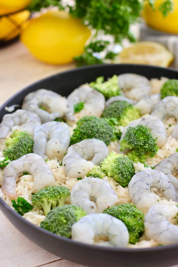 top off shrimp and rice with broccoli