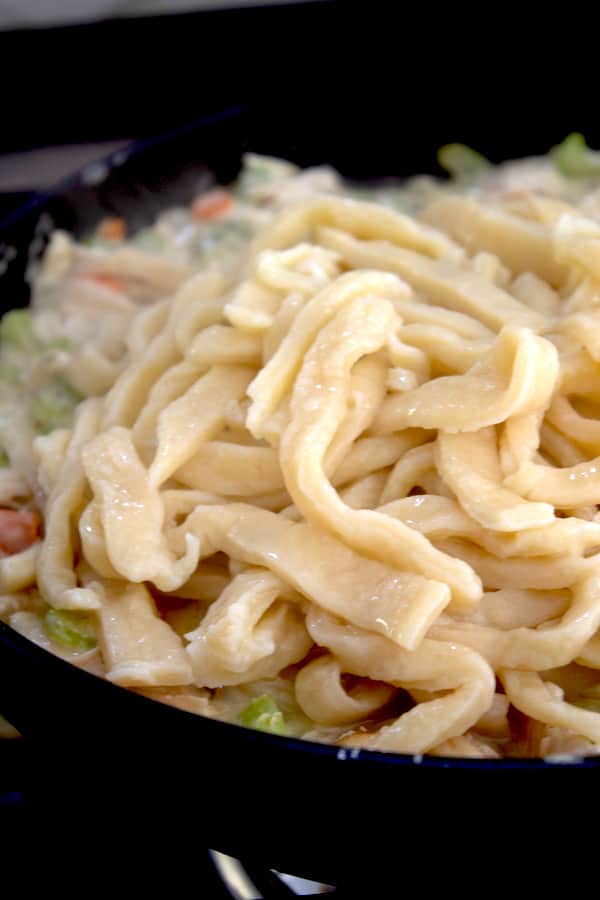 boiled egg noodles in a pan on the stove