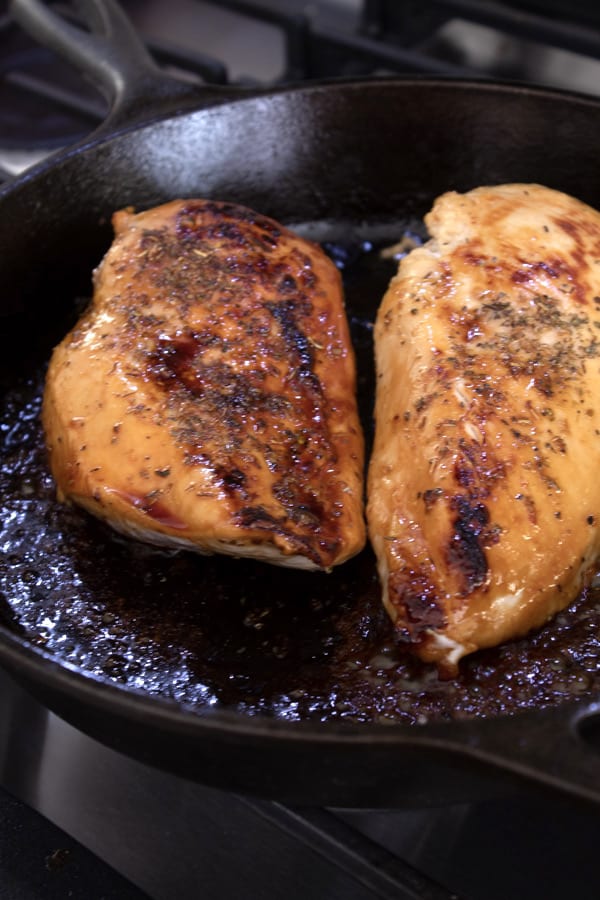 searing chicken in cast iron skillet with honey and butter