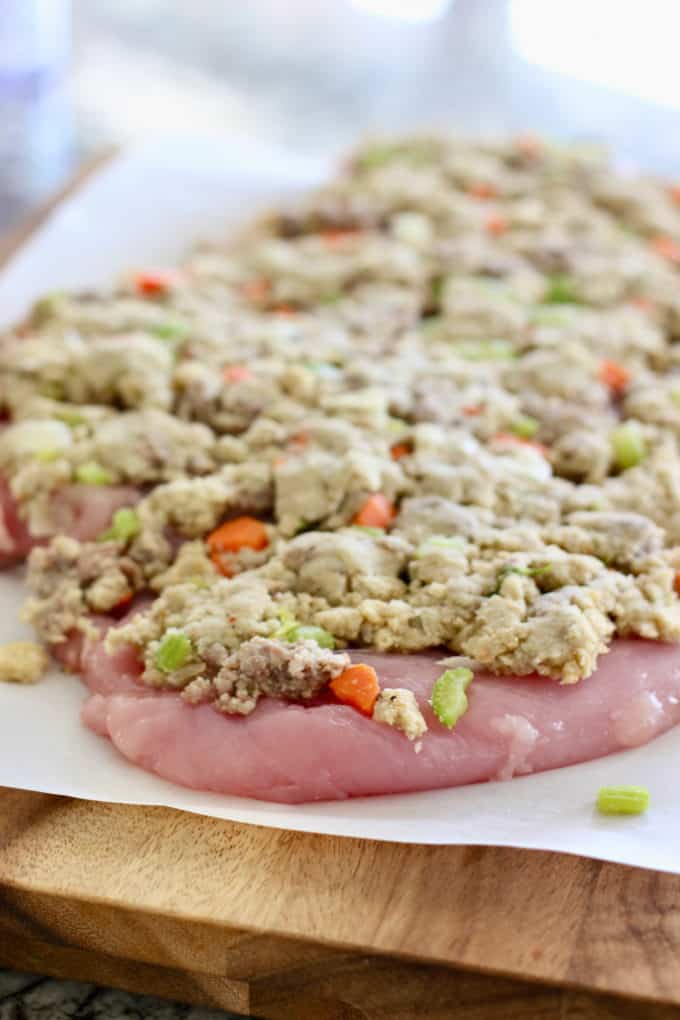 flatten sausage dressing on top of butterflied turkey breast