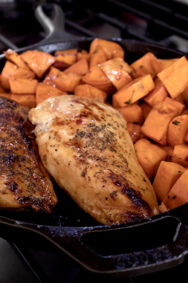 chicken and sweet potatoes before baking in oven