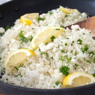 full view of greek rice in a black pan