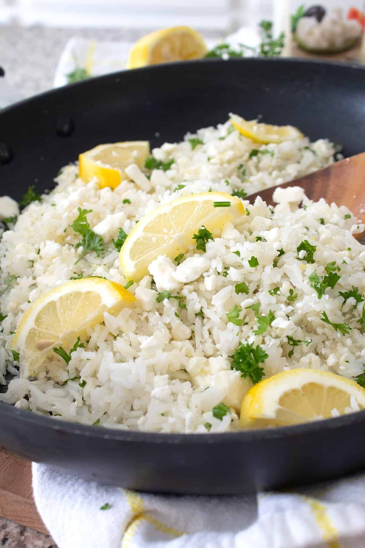 full view of greek rice in a black pan