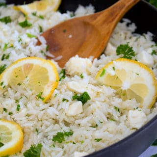 pan of greek rice with wooden spoon