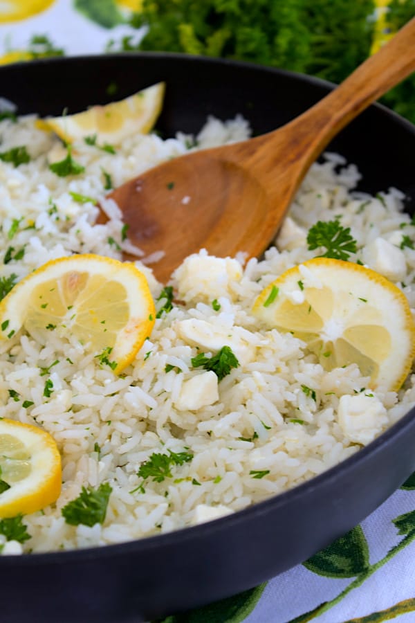 pan of greek rice with wooden spoon