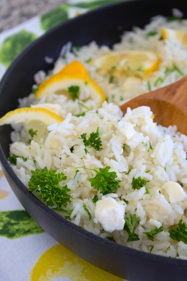 a pan of rice with feta lemon and parsley