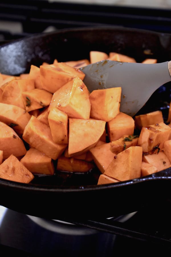 cooking sweet potatoes in skillet