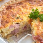 baked quiche with slice taken out