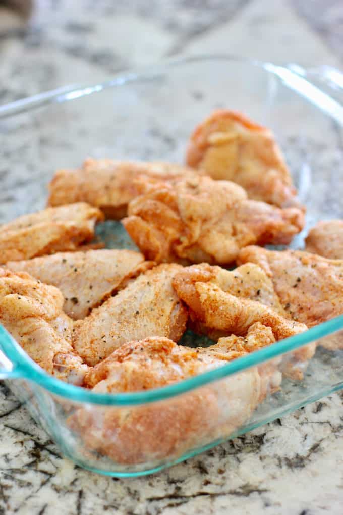 uncooked chicken wings with dry rub applied