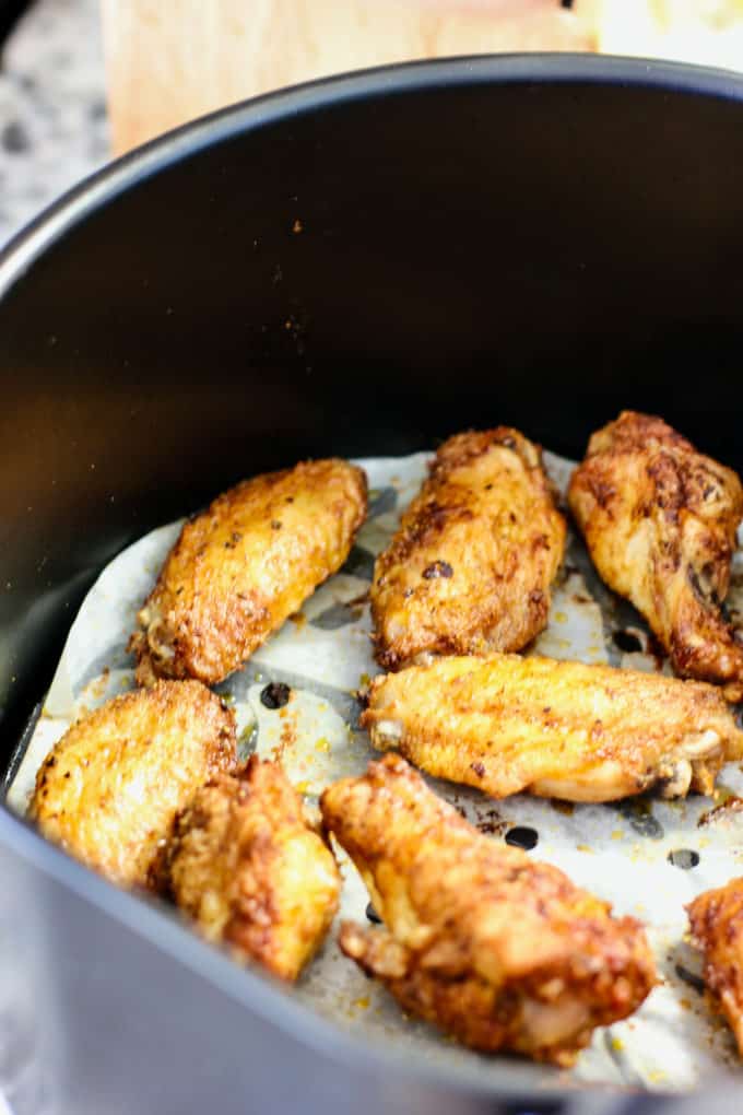cooked wings in an air fryer basket