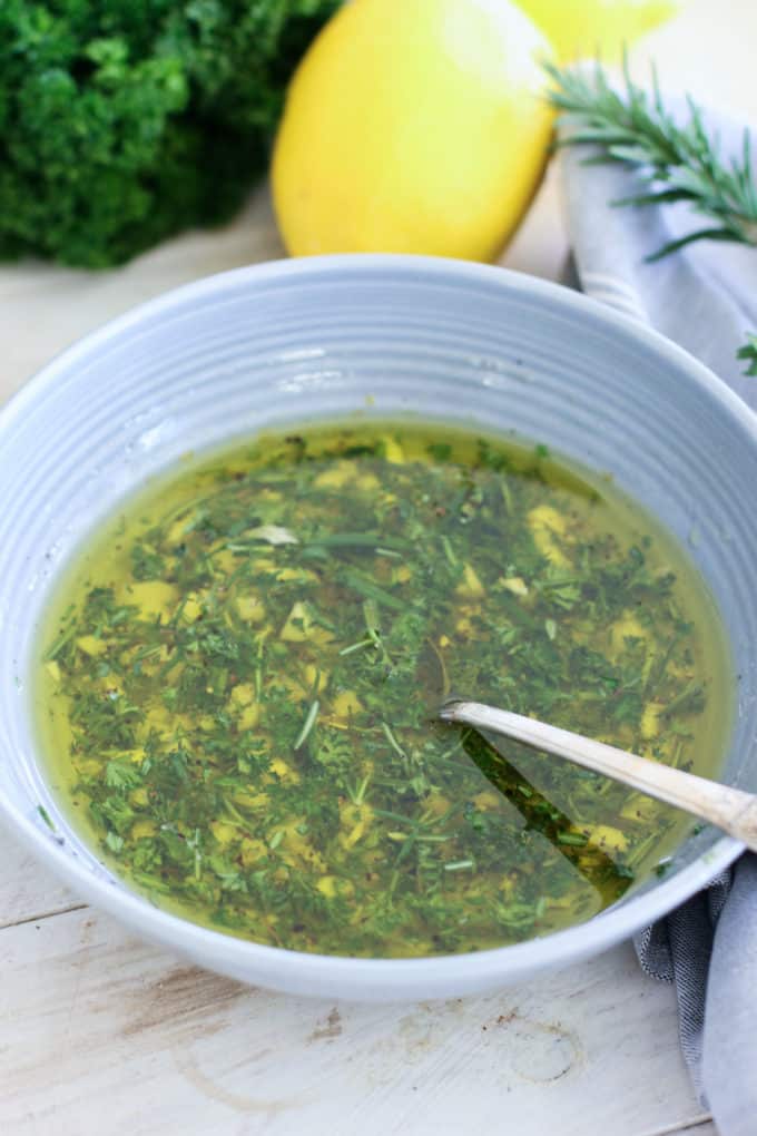 olive oil, lemon juice and fresh herbs in a bowl