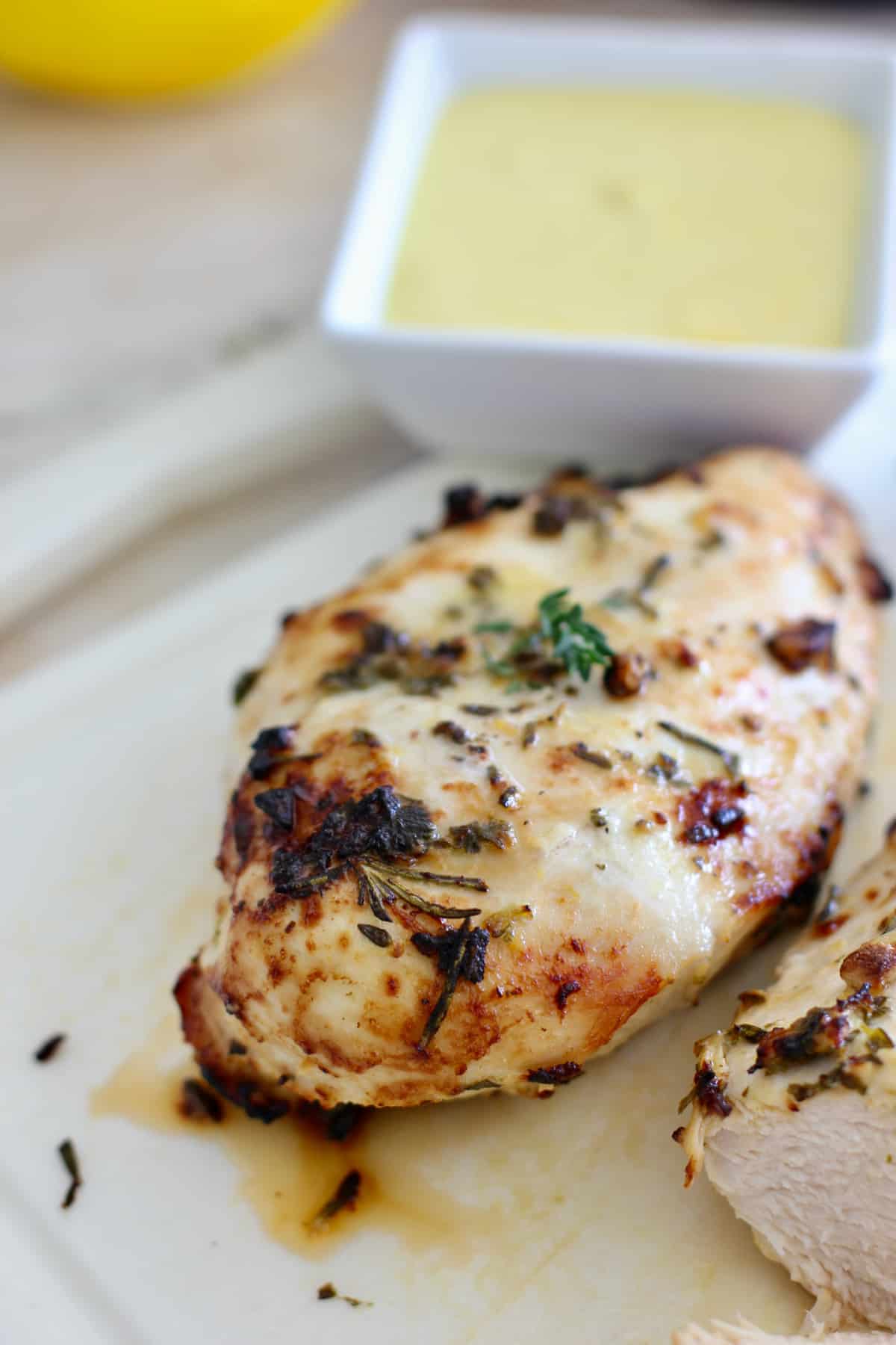 whole chicken breast on a cutting board