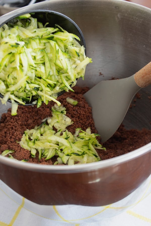 adding shredded zucchini to batter