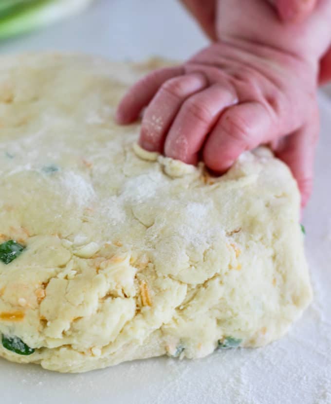 baby fingers in biscuit dough