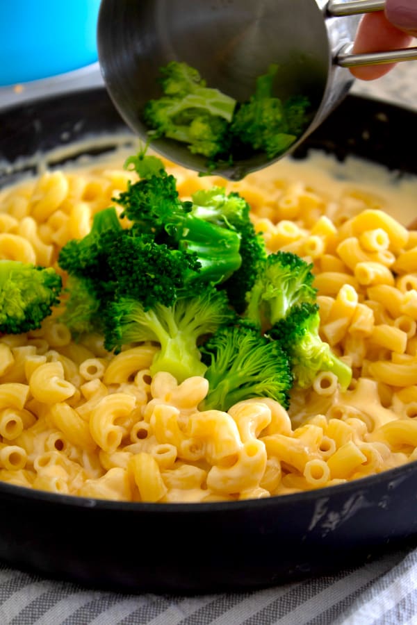 adding broccoli to pasta 