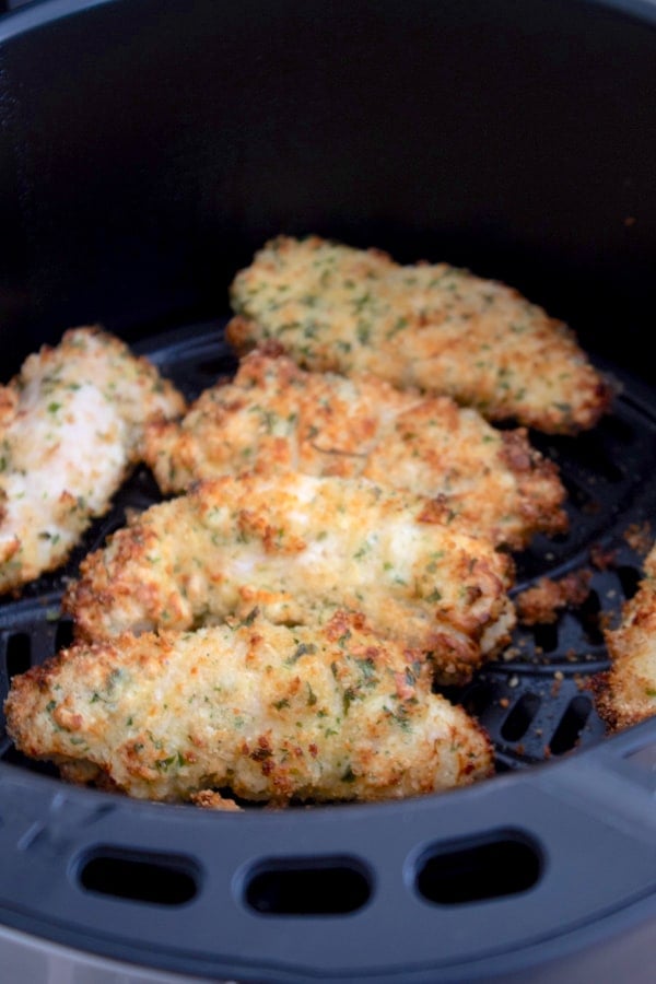 closeup of air fryer chicken tenders in air fryer basket