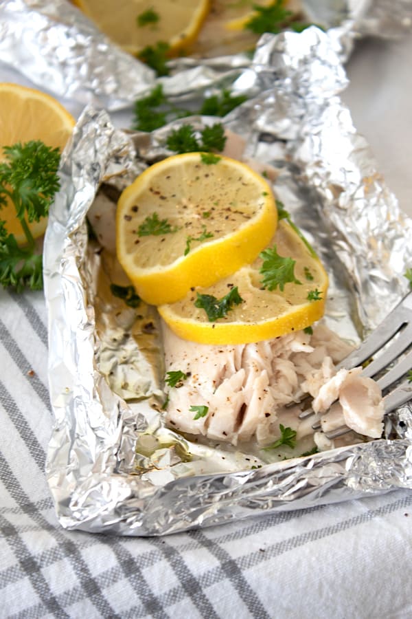 flakey mahi mahi in foil packet with lemon and parsley