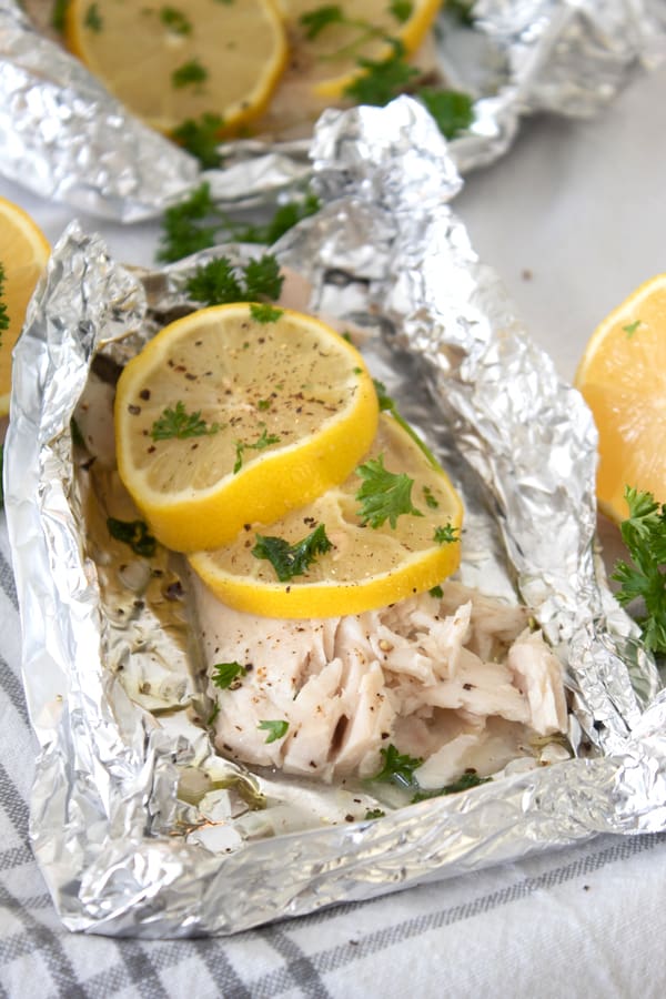 mahi mahi in a foil packet with lemon and parsley