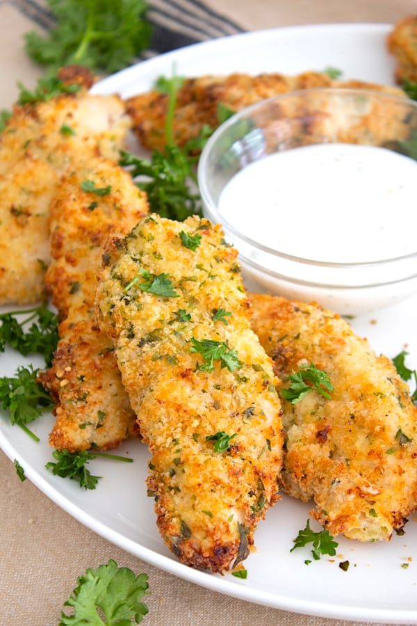 plate of chicken tenderloins with ranch dressing in bowl