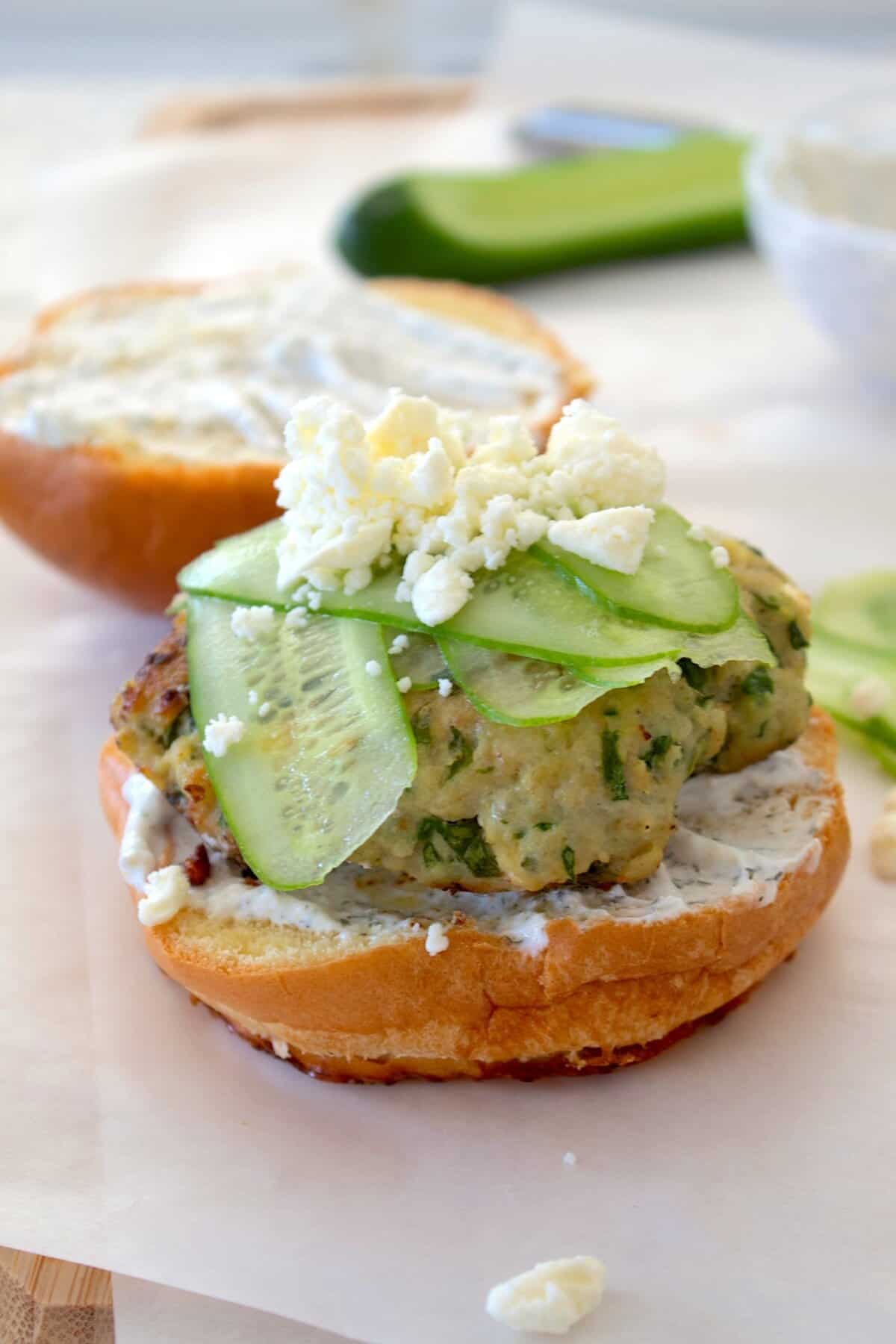spinach feta burger with cucumber strips and feta cheese