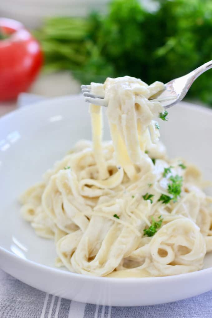 Pasta being served up with a fork