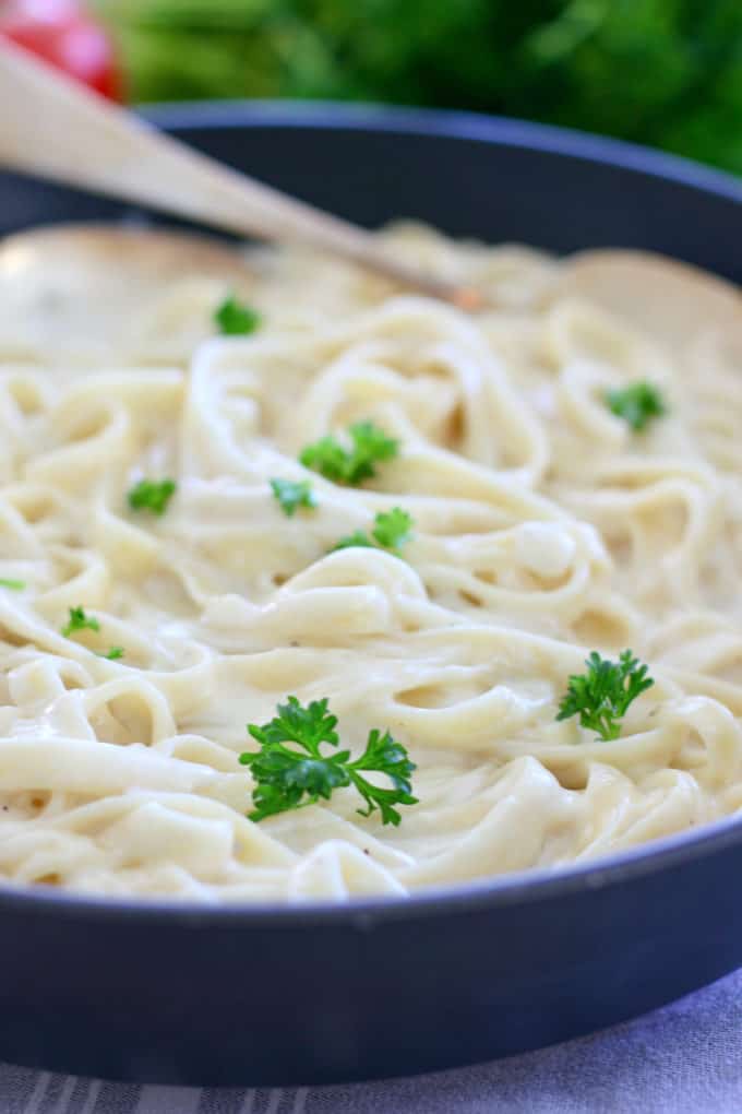 Fast Fettucine Alfredo in a black skillet