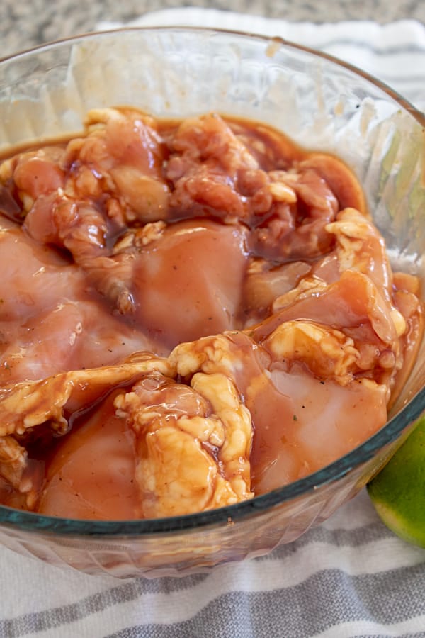 marinating chicken in glass bowl