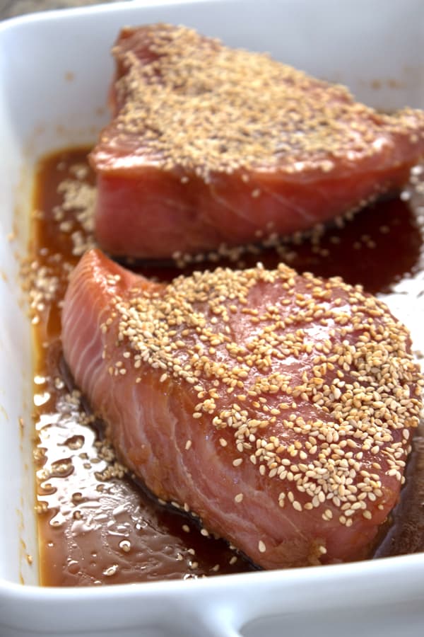 marinating 2 ahi steaks in a casserole dish