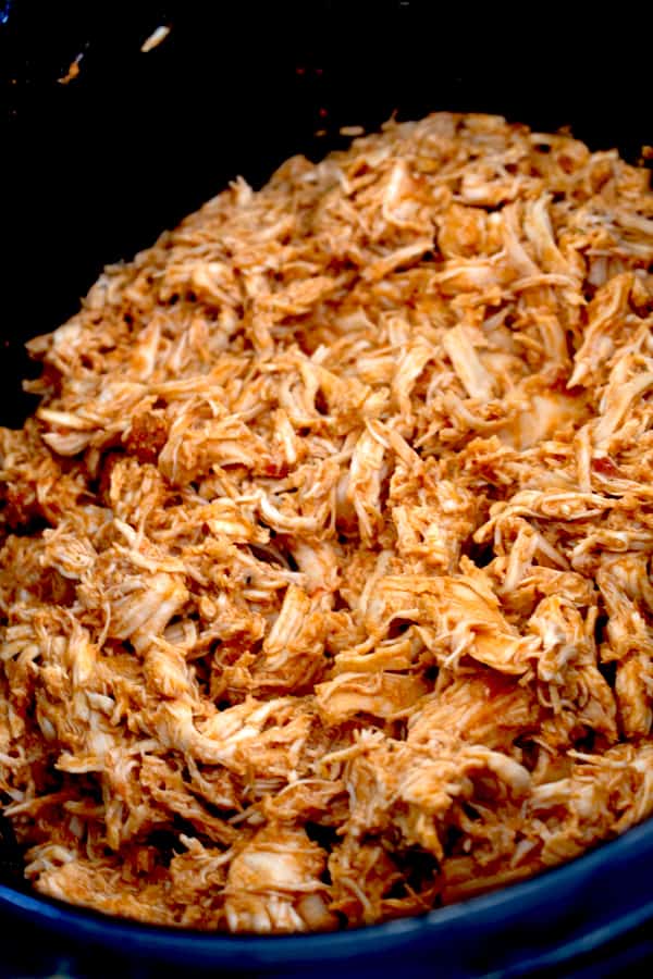 slow cooker full of shredded chicken taco meat