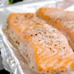 side view of cooked salmon filet on a sheet pan