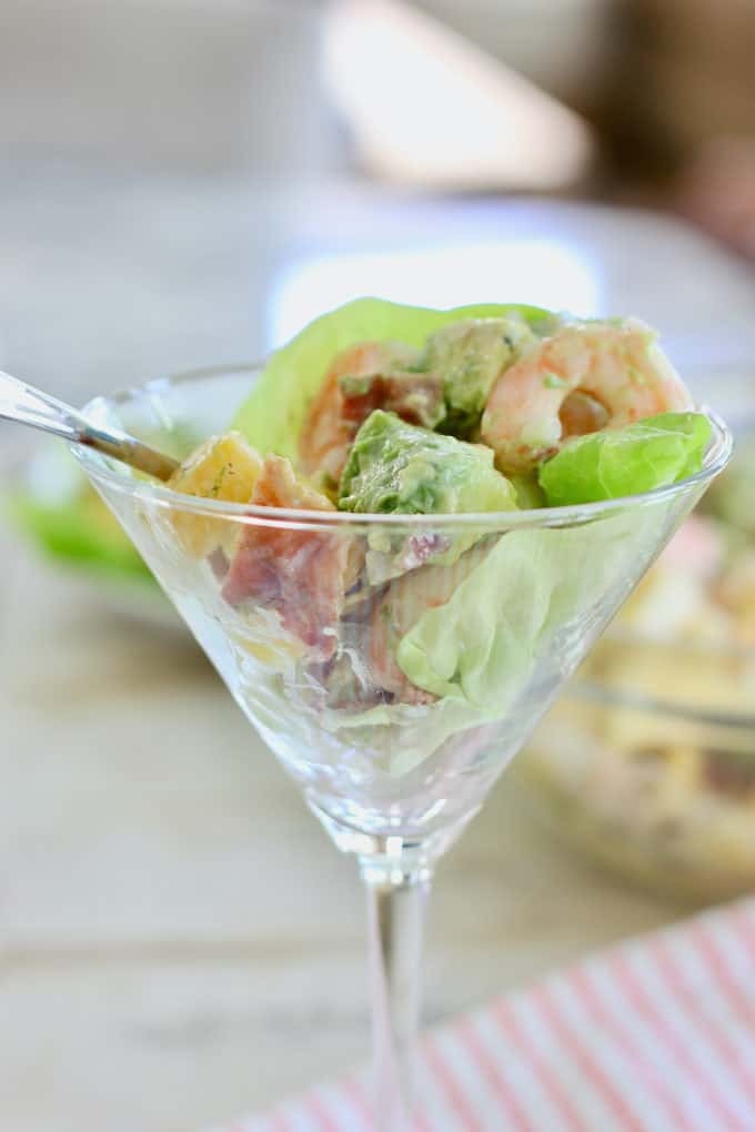 Avocado Shrimp Salad being served in a martini glass