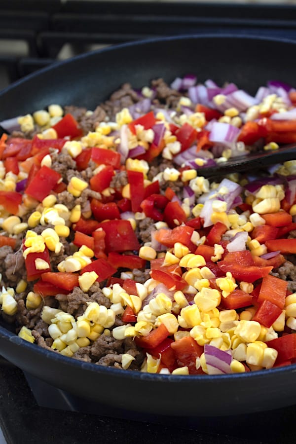Taco pasta b beef and veggies cooking in a pan
