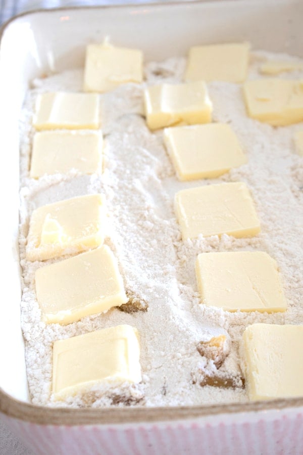 adding cold cubed butter on top of cake mix