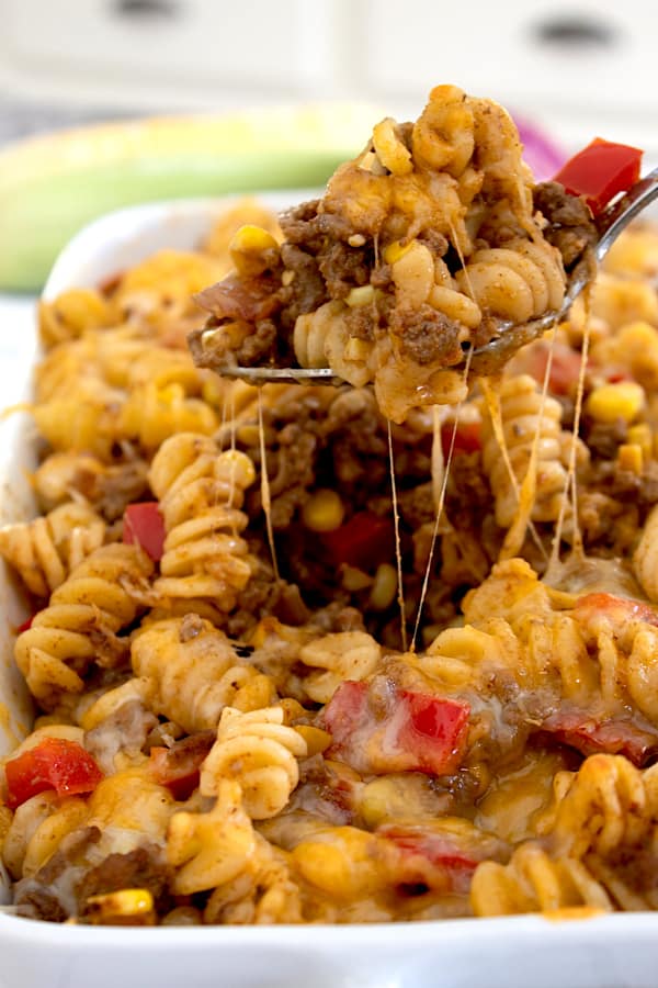 cooked taco pasta in a white casserole dish