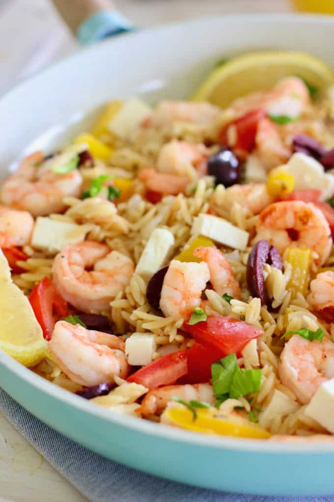 shrimp skillet dinner with orzo in a blue pan